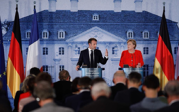 Macron și Merkel vor să trimită migranții în țările în care aceștia au intrat în UE