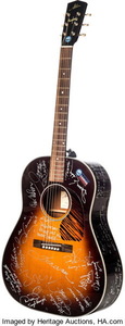 O chitară cu autografele a 75 de muzicieni celebri, printre care Eric Clapton, Keith Richards, Paul McCartney, va fi scoasă la licitaţie 