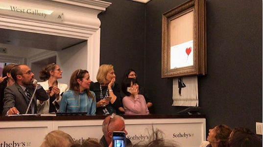 „Girl With Balloon” a lui Banksy s-a autodistrus după ce a fost adjudecată contra sumei de 1,04 milioane de lire sterline - VIDEO