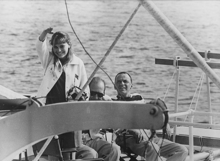 14th July 1966:  American actress Mia Farrow and actor singer Frank Sinatra (right) on board the ship 'Southern Breeze' before their marriage.  (Photo by Keystone/Getty Images)
