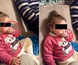 Imagini revoltatoare! O fetita de 2 ani din Tulcea, fortata de parinti sa bea si sa fumeze