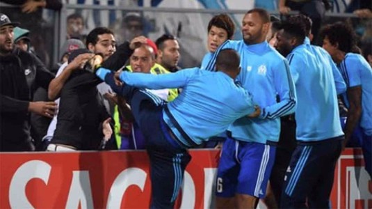 Zi neagră pentru Patrice Evra! Decizie drastică luată de UEFA, apoi dat afară de Marseille după ce a lovit un fan