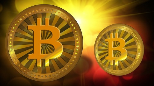 Moneda virtuală bitcoin a crescut la un nivel record de peste 1.700 de dolari