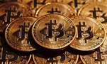 Bitcoin trece și de 6.000 de dolari. Capitalizarea criptomonedei urcă la o valoare record de 102 miliarde dolari