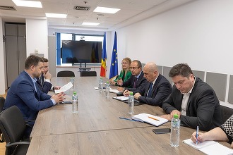 FOTO Bolojan, discuție pentru încălzirea mai bună a Bucureștiului