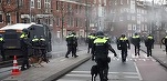 VIDEO Olanda, proteste față de restricții: tunuri cu apă, gaze, mașini incendiate, magazine vandalizate