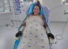 Pacienta internată în Spitalul Floreasca din Capitală, cu arsuri pe 70% din corp, şi transferată apoi în stare gravă la un spital din Belgia a reuşit să stea într-un fotoliu, fiind mutată cu ajutorul unui robot special/ Anunţul surorii sale