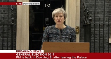 May acuză fără să numească politicieni şi oficiali de la Bruxelles că se amestecă în alegerile britanice