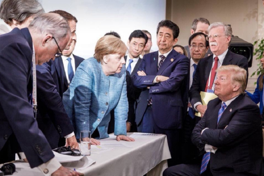 Trump în faţa lui Merkel, într-o fotografie-simbol de la G7, provoacă o dezbatere