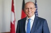 O victorie a lui Biden în SUA ar aduce o senzaţie de uşurare, dar puţine soluţii, a declarat un aliat al cancelarului Merkel