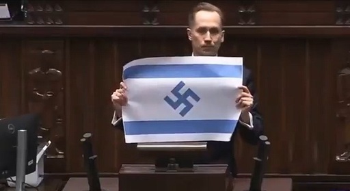 ”Israelul este noul al III-lea Reich”, apreciază în Parlamentul polonez un deputat de extremă dreapta şi agită un steag israelian cu o svastică în locul stelei lui David. Konrad Berkowicz de la Partidului Konfederacja acuză Israelul de ”genocid” în Războiul din O.Mijlociu