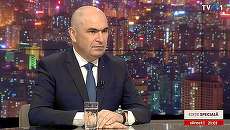 Bolojan apare, audienţa sare! Premierul a crescut ratingul TVR 1 de trei-patru ori de la o oră la alta! Pe comercial, de zece ori! Câţi români au văzut interviul cu el?